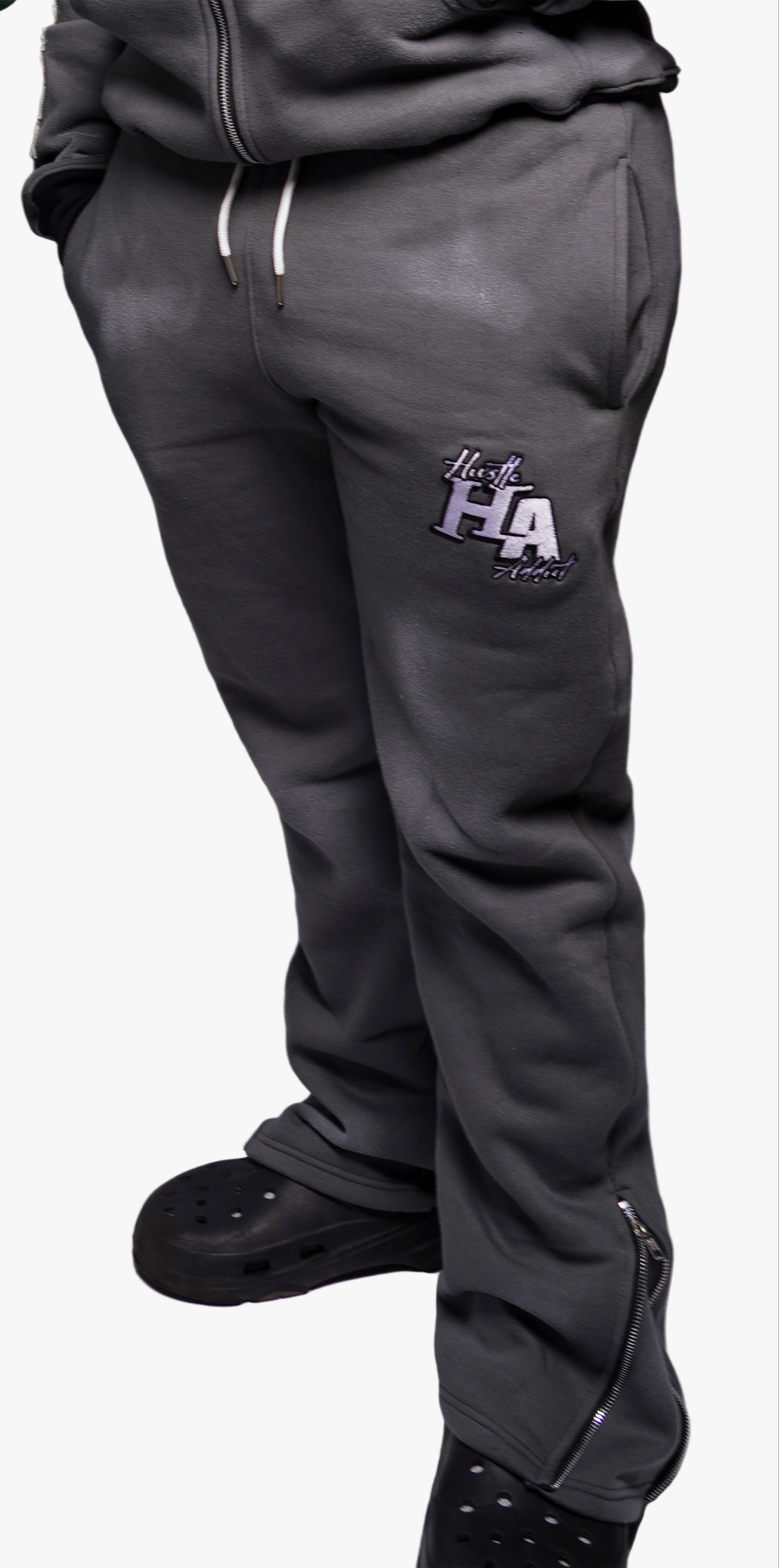 Gray tracksuit pants with a logo on a white background